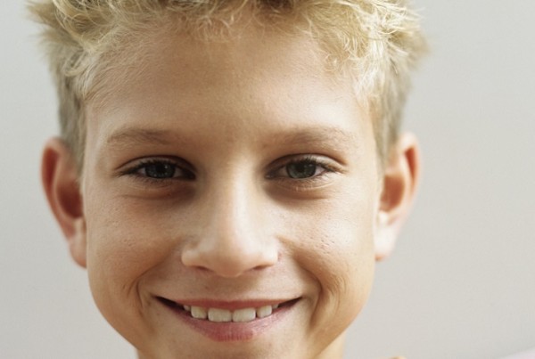 Boy (12-13) smiling,portrait,close-up