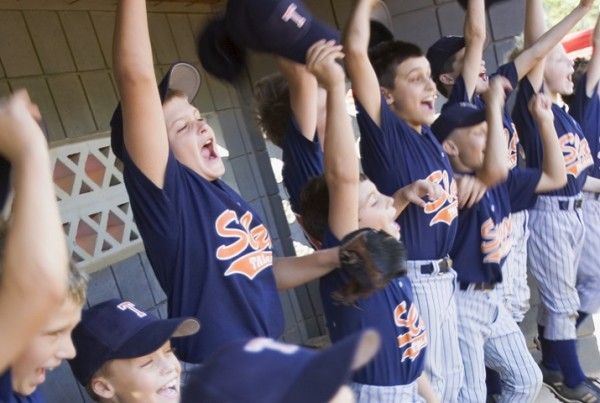 Young Baseball Team Cheering --- Image by © Kevin Dodge/Corbis